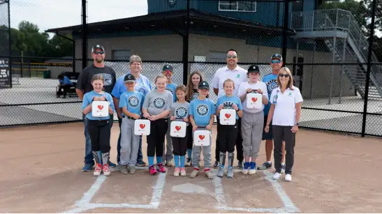 A group of little league players with their coaches